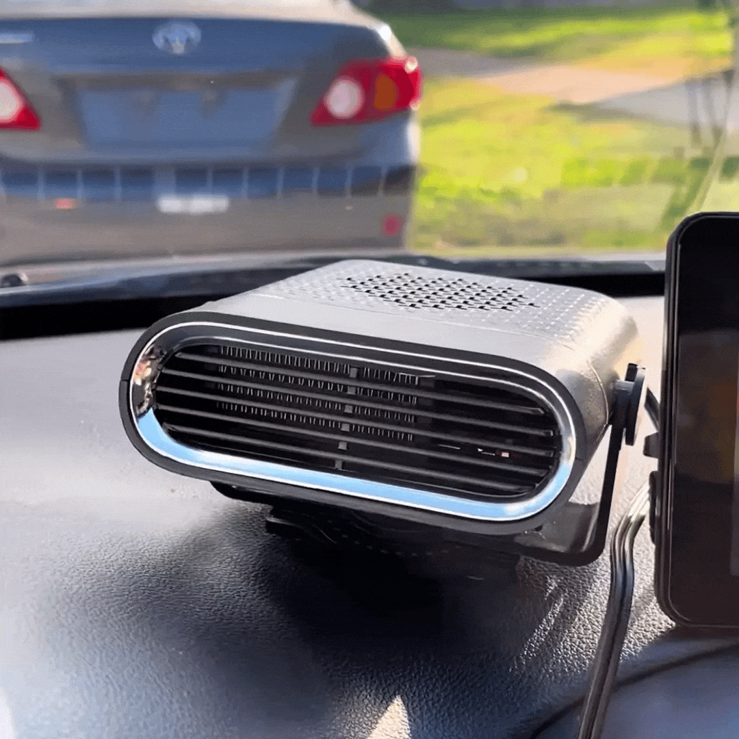 Kompakte Autoheizung mit Lüftungsgitter auf Armaturenbrett, angeschlossen per Kabel